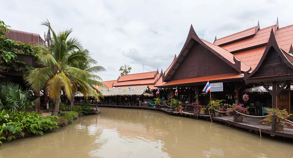 Wooden walkways, pavilions and boats at Ayothaya floating market, Ayutthaya