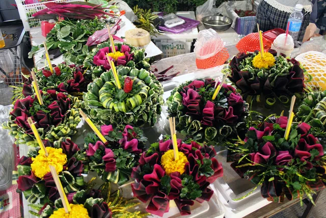 Decorated banana-leaf krathong floats for sale before Loy Krathong
