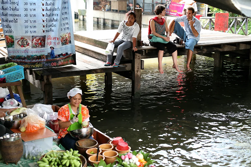 Taling Chan floating market stalls and boats beside a Bangkok khlong