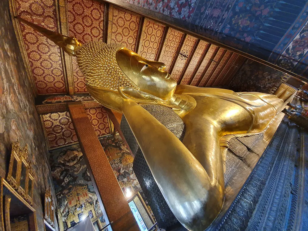 Gilded reclining Buddha statue inside Wat Pho temple, Bangkok